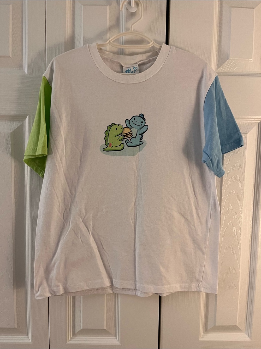 ME Makeover Essentials White Tee with Green & Blue Dino Graphic